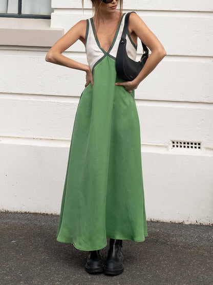 Vestido elegante con empalme de color en contraste con cuello en V